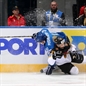 MINSK, BELARUS - MAY 10: Germany's Sinan Akdag #82 and Kazakhstan's Konstantin Pushkaryov #81 get tangled up along the board battling for the puck during preliminary round action at the 2014 IIHF Ice Hockey World Championship. (Photo by Andre Ringuette/HHOF-IIHF Images)